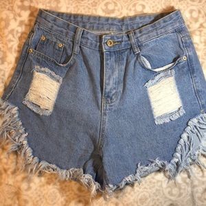 Distressed very high waisted jean shorts